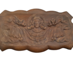 Jesus engraved in oak